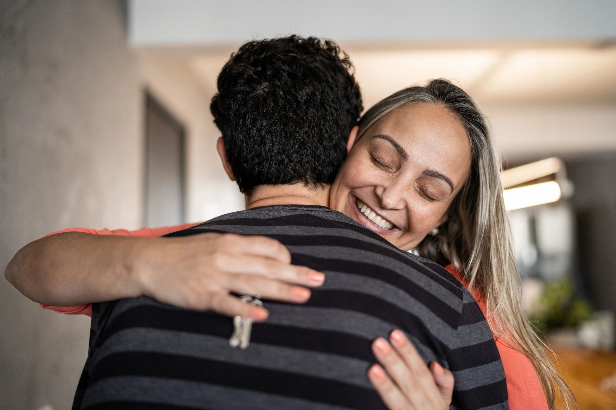 Couple celebrating with keys to their new home